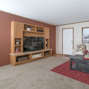 Photo of manufactured home interior furnished living area with entertainment console