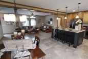 Modular home ranch 52J738-JM living room Photo Of Modular Home Ranch 52J738-Jm View From Kitchen Into Furnished Living Room