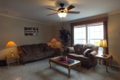 Double wide home 5225-508 living room Photo Of Double Wide Home 5225-508 Furnished Living Room With Bright Windows And Ceiling Fan