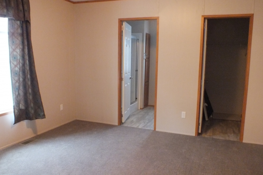 294 stock model single wide home bedroom A Photo Of Stock Model 294 Single Wide Home Unfurnished Bedroom With Bathroom Access And Closet