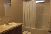 294 stock model single wide home bathroom A Photo Of Stock Model 294 Single Wide Home Bathroom Sink, Tub, And Toilet.