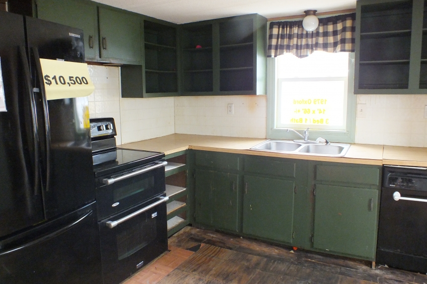 1979 Oxford single wide home kitchen Photo Of 979 Oxford Single Wide Home Kitchen With Black Dishwasher And Stove And Cabinets