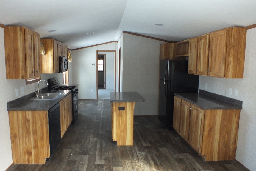 Single wide home in Milton Vermont kitchen A Photo Of 141 Milton Vermont Single Wide Home Kitchen With Wood Cabinets