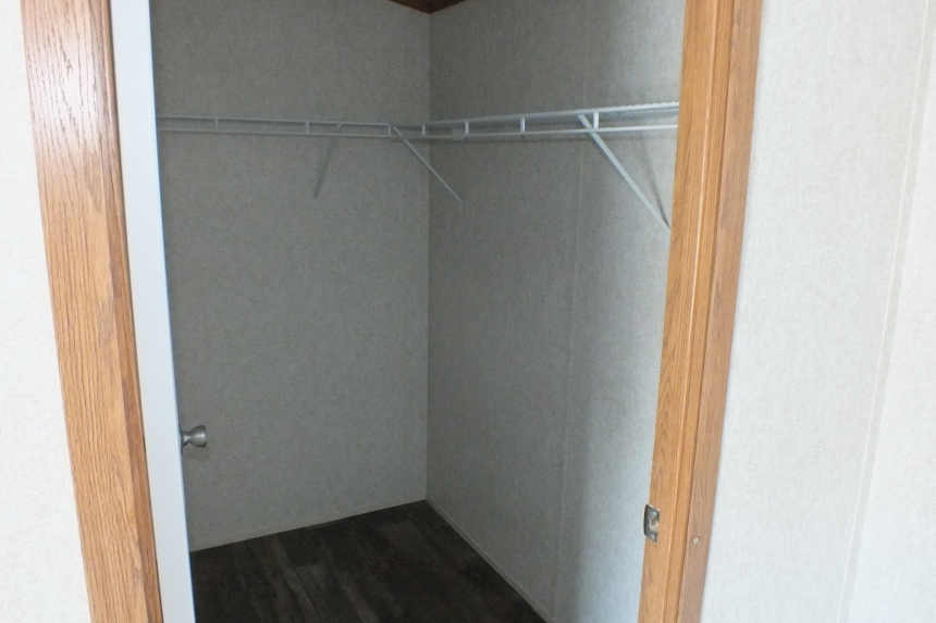 Single wide home in Milton Vermont closet A Photo Of 141 Milton Vermont Single Wide Home Bedroom Closet With Wire Shelving.