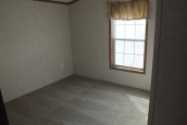 Single wide home in Milton Vermont bright window A Photo Of 141 Milton Vermont Single Wide Home Room With Bright Window.
