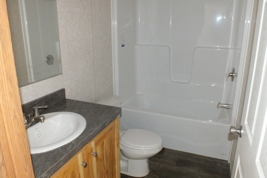 Single wide home in Milton Vermont bathroom A Photo Of 141 Milton Vermont Single Wide Home Bathroom With Sink And Toilet.