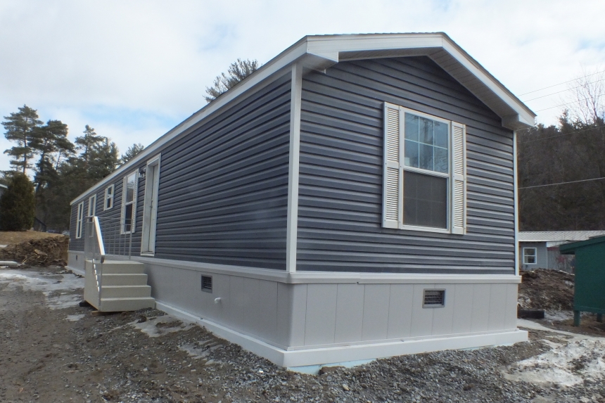 Single wide home in Milton Vermont exterior A Photo Of 141 Milton Vermont Single Wide Home Gray Exterior