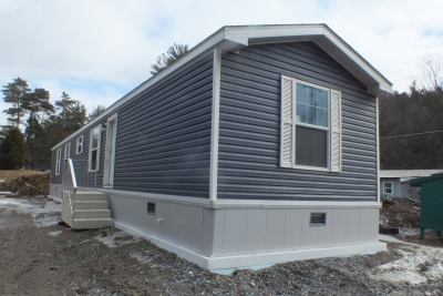 A Photo Of 141 Milton Vermont Single Wide Home Gray Exterior