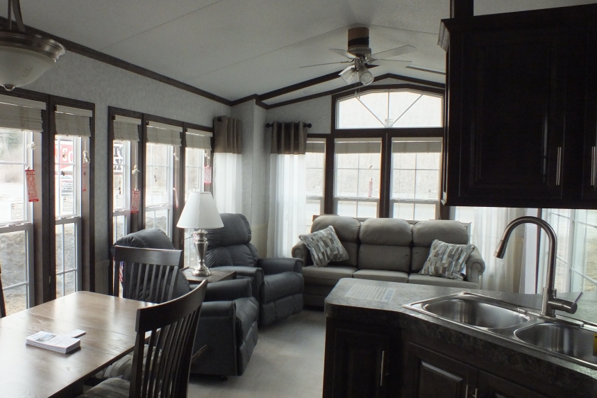 The Park Model 7 manufactured home kitchen and living area A Photo Of Park Model 8 Manufactured Home Furnished Living And Dining Area Seen From Kitchen