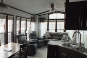 The Park Model 7 manufactured home kitchen and living area A Photo Of Park Model 8 Manufactured Home Furnished Living And Dining Area Seen From Kitchen