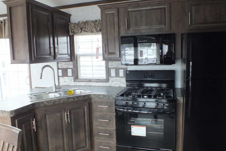 The Park Model 7 manufactured home kitchen stove A Photo Of Park Model 8 Manufactured Home Black Kitchen Stove And Wood Cabinets.