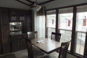 The Park Model 7 manufactured home dining area A Photo Of Park Model 8 Manufactured Home Dining Area With Able In Front Of Large Bright Windows.
