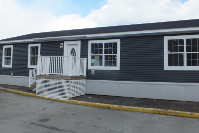 A Photo Of The Brown Exterior Of The Stock Model 307 Manufactured Home.