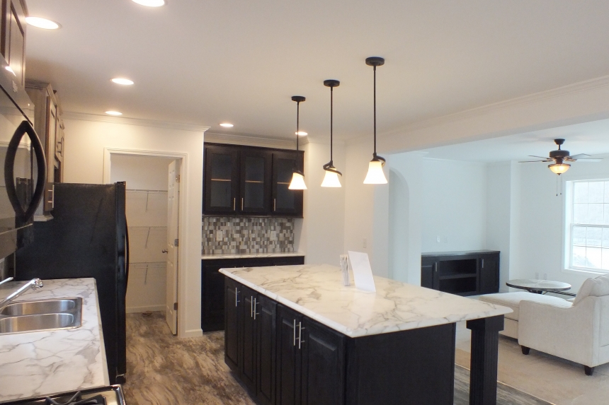 Stock Model 307 kitchen island and lighting A Photo Of The Stock Model 307 Manufactured Home Kitchen And Living Room
