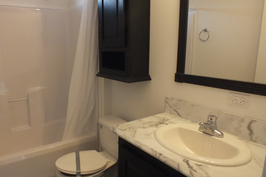 Stock Model 307 bathroom sink, toilet, and shower A Photo Of The Stock Model 307 Manufactured Home Bathroom Sink, Toilet And Shower