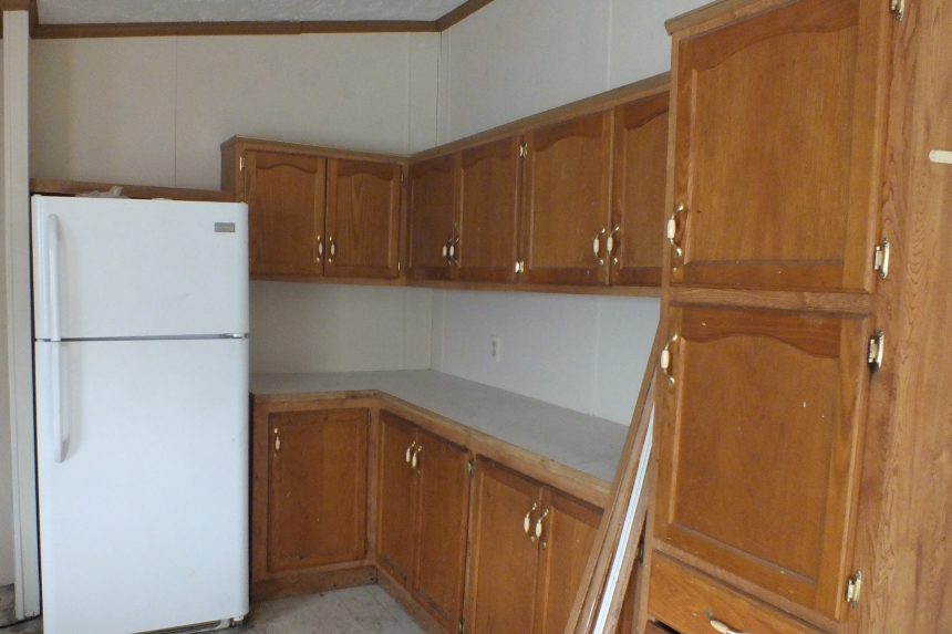 Double wide 2000 Dutch kitchen Photo Of Double Wide Home 2000 Dutch Kitchen With White Refrigerator And Wood Cabinets