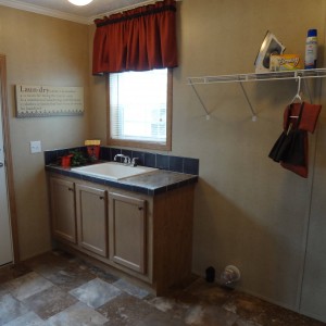 Photo of manufactured home interior entry way with window and sink
