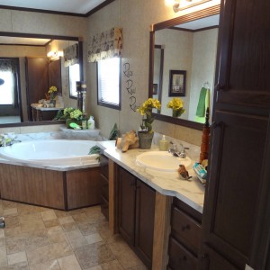 Photo of manufactured home bathroom large tub and bathroom sink