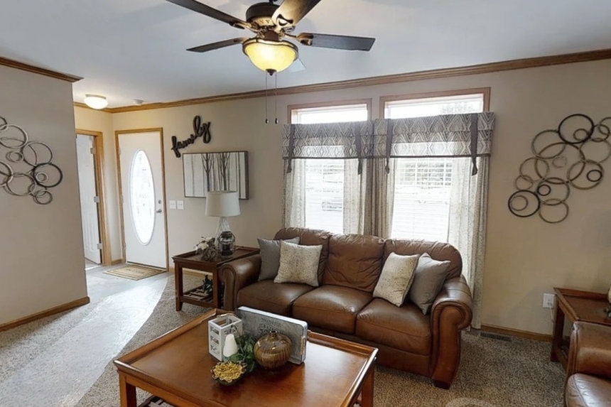 Modular home ranch 52J738-JM living area and couch Photo Of Modular Home Ranch 52J738-Jm Furnished Living Area With Ceiling Fan