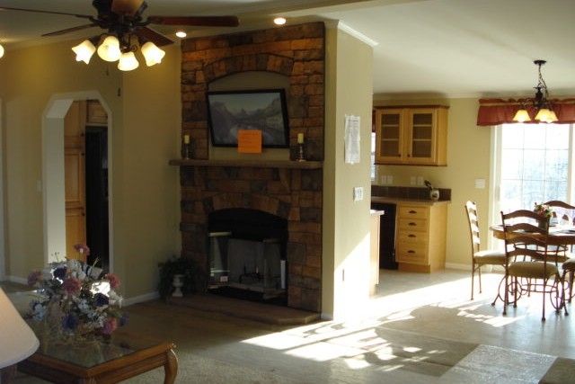 Double Wide home 5228-405-1 living area Photo Of Double Wide Home 5228-405-1 Furnished Living Area Looking Into Bright Dining Room