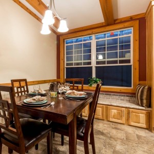 Photo of manufactured home interior dining area with small table and large windows