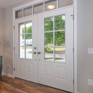 Photo of manufactured home interior with double doors and large windows