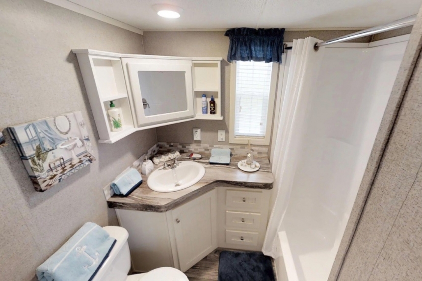 Park Model 40FKL bathroom A Photo Of Park Model 40Flk White Bathroom Vanity And Shower