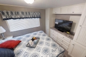 Park Model 40FKL bedroom A Photo Of Park Model 40Flk Bedroom With Built In Dresser And Large Window