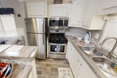 Park Model 40FKL kitchen A Photo Of Park Model 40Flk Kitchen With White Cabinets And Appliances