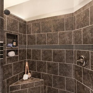 Photo of manufactured home bathroom large shower with big brown tiles