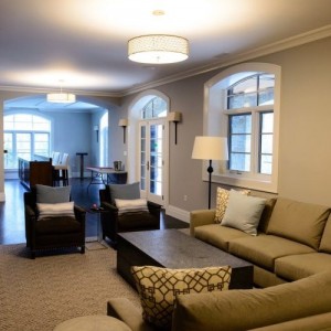 Photo of manufactured home interior living area with couches looking into bright window