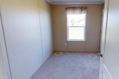 Single wide home 8016-721 bedroom Photo Of Single Wide Home 8016-721 Unfurnished Bedroom With Bright Window