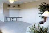 Single wide home 8016-721 living area Photo Of Single Wide Home 8016-721 Furnished Living Room With White Sofa Plants And Lamp
